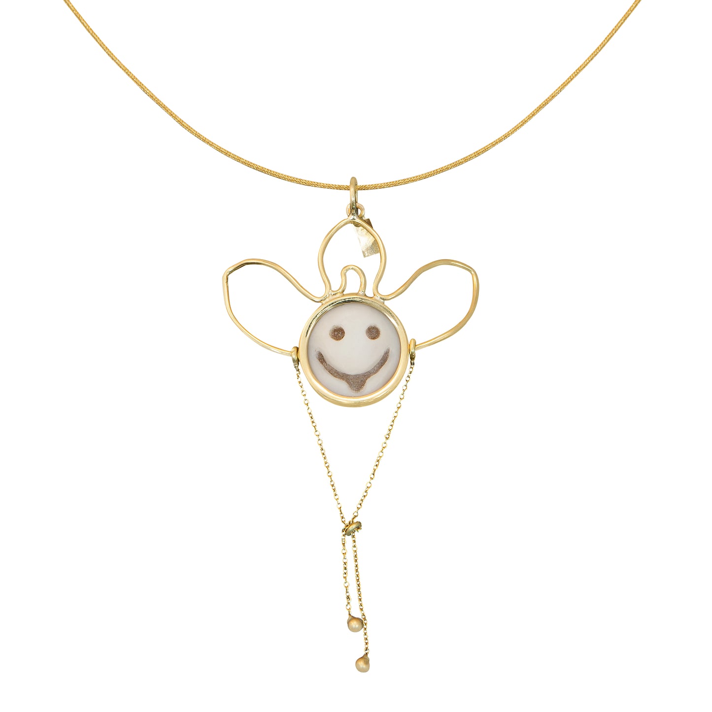 Hand-carved cameo pendant in 18k yellow gold featuring a smiling design by Bed of Stones Jewelry
