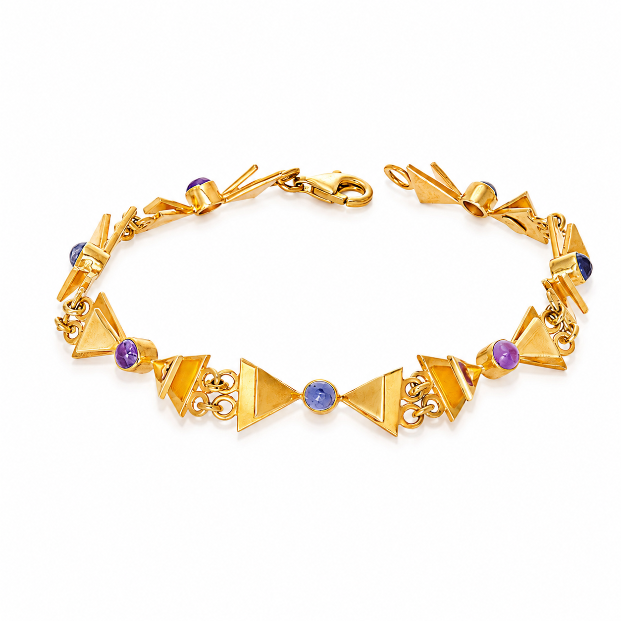 A gold-toned geometric link bracelet featuring triangular links and small round purple and blue gemstones, displayed on a clean white background.