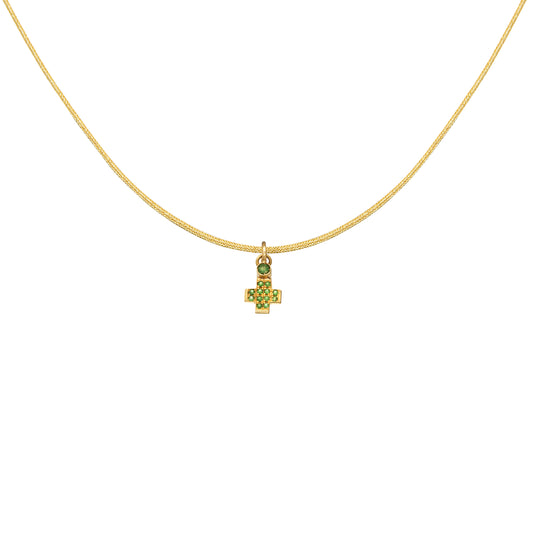 Small 18k yellow gold cross pendant embellished with 0.072ct and 0.044ct tsavorite gemstones by Bed of Stones Jewelry