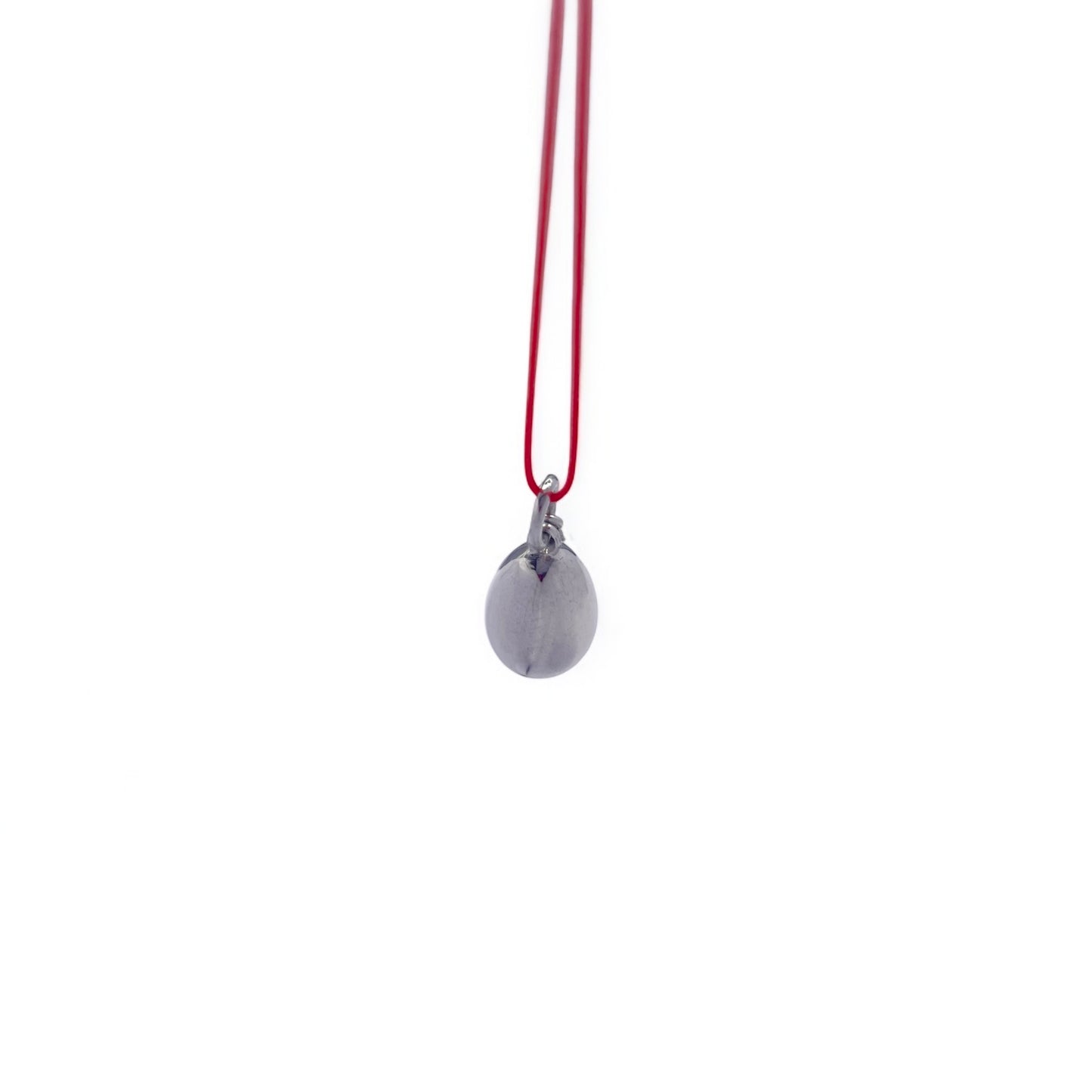 Minimalist  metallic  pendant on cord