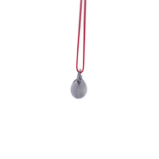 Minimalist  metallic  pendant on cord
