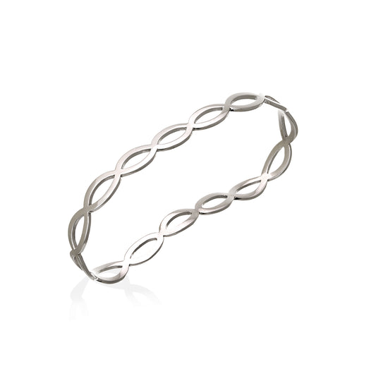 Palm-inspired gold bangle with organic curved design by Bed of Stones Jewelry