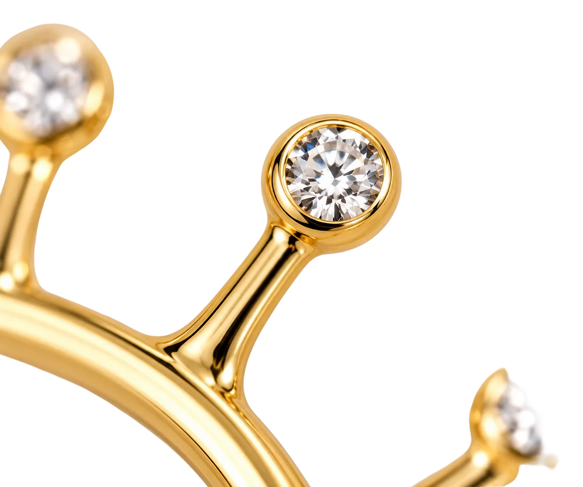 Close-up of diamond bezel setting on Solar Flare 18K Gold Ear Cuff by Bed of Stones Jewelry