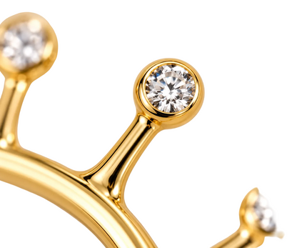 Close-up of diamond bezel setting on Solar Flare 18K Gold Ear Cuff by Bed of Stones Jewelry