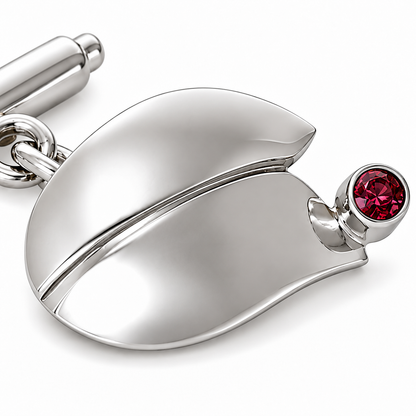 Close-up of round-cut tourmaline bezel setting on Tulip Curve Sterling Silver Cufflinks by Bed of Stones Jewelry
