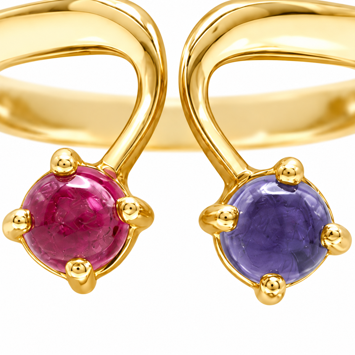 Close-up of cabochon-cut pink tourmaline and iolite prong setting on Aurora Ray 18K Gold Ring by Bed of Stones Jewelry