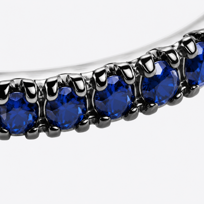Close-up of blue sapphire pavé detail on Azure Twist Sterling Silver Ear Cuff by Bed of Stones Jewelry