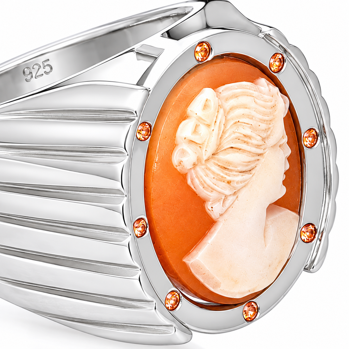 Close-up of oval hand-carved cameo bezel setting and round-cut orange sapphire gypsy setting on Cameo Reverie Sterling Silver (925) Ring by Bed of Stones Jewelry