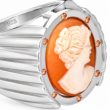 Close-up of oval hand-carved cameo bezel setting and round-cut orange sapphire gypsy setting on Cameo Reverie Sterling Silver (925) Ring by Bed of Stones Jewelry