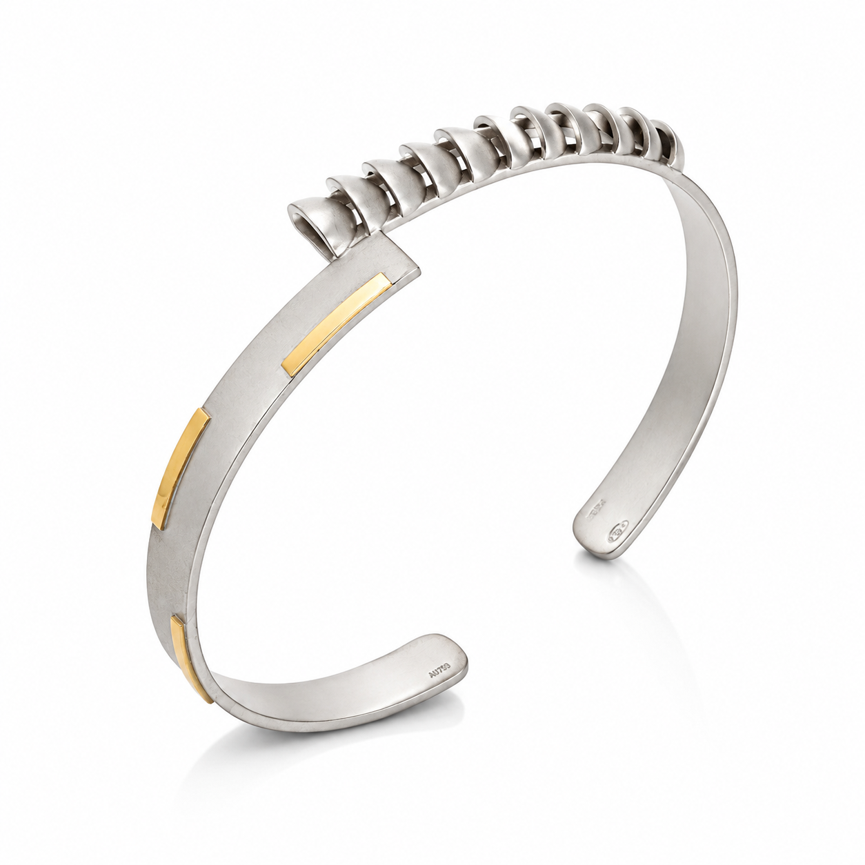 Sterling silver open cuff bracelet with 18K gold inlays and sculptural looped detailing on a white background.