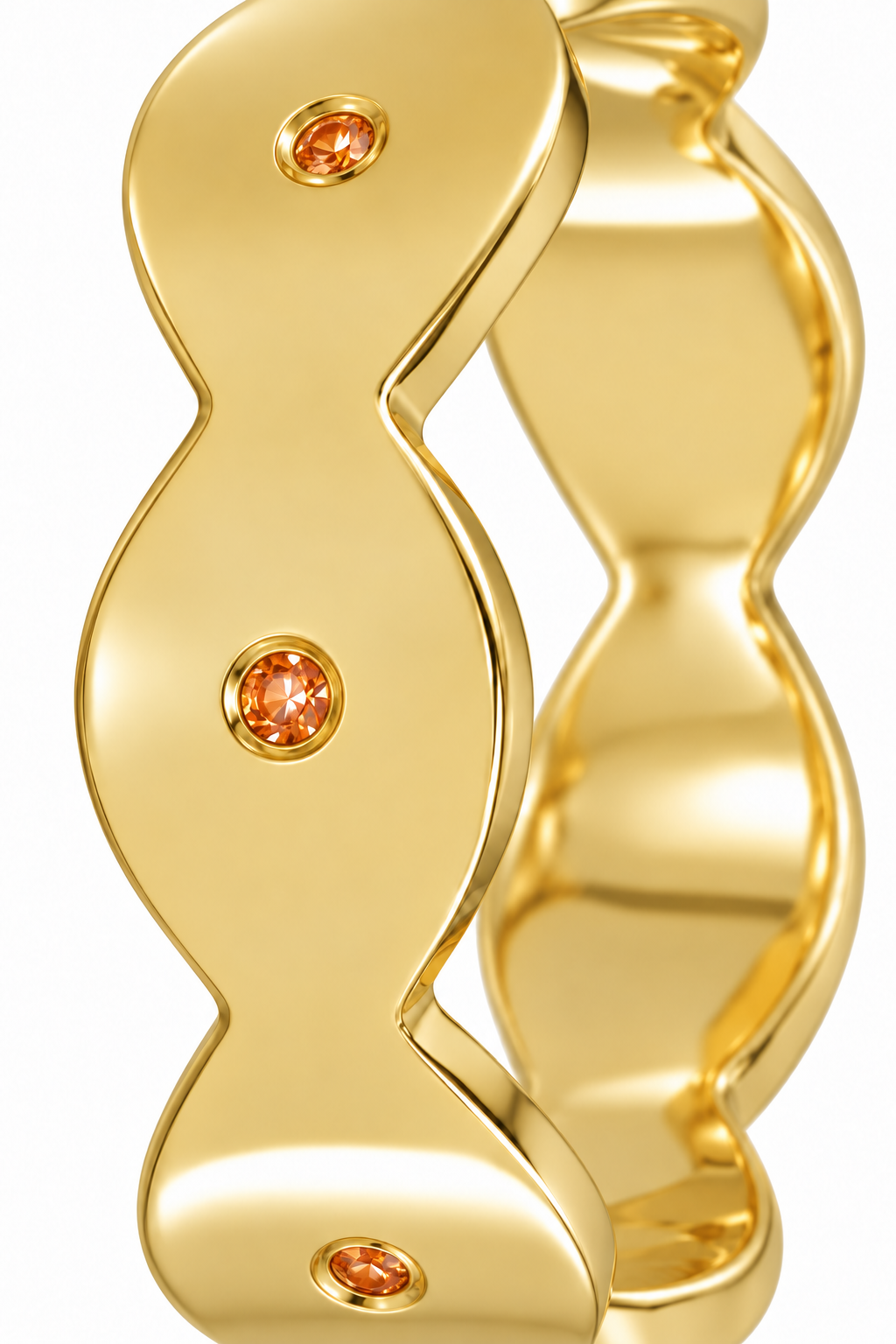 Close-up of round-cut orange sapphire gypsy setting on Dune Glint Band Sterling Silver & 18K Gold Plated by Bed of Stones Jewelry