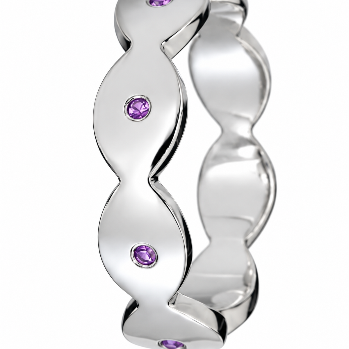 Close-up of round-cut amethyst gypsy setting on Dune Glint Band Sterling Silver by Bed of Stones Jewelry