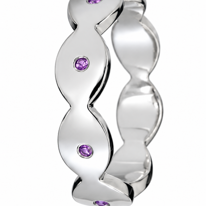 Close-up of round-cut amethyst gypsy setting on Dune Glint Band Sterling Silver by Bed of Stones Jewelry