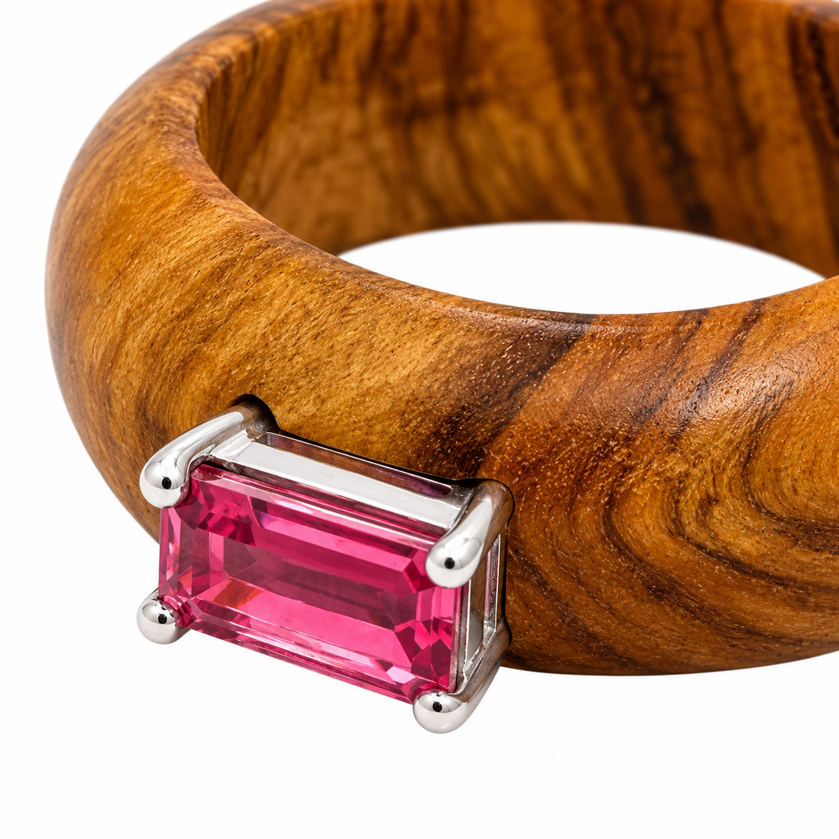 Close-up of baguette-cut pink tourmaline prong setting on Earthline Olive Wood & Sterling Silver (925) Ring by Bed of Stones Jewelry