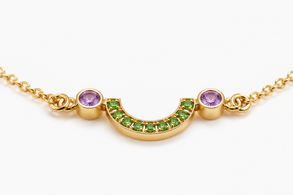 Close-up of tsavorite and amethyst pavé-bezel setting on Gem Light 18K Gold Bracelet by Bed of Stones Jewelry