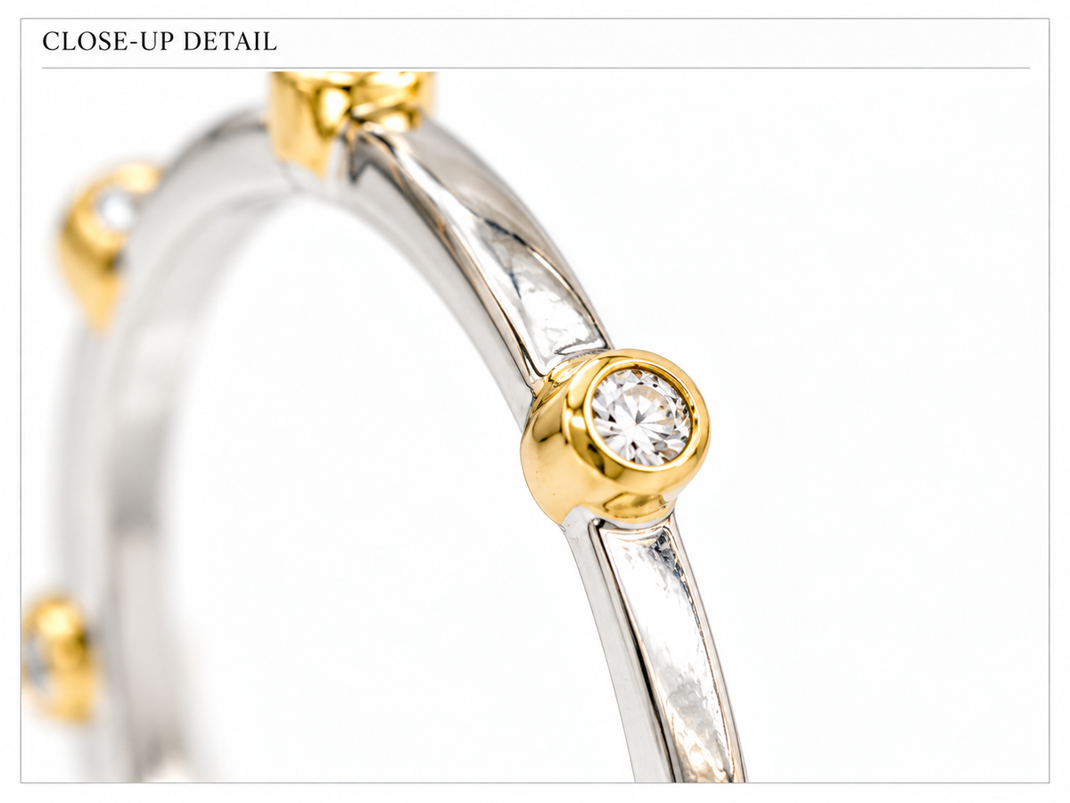 Close-up of round-cut white diamond bezel setting on Glint Diamond Ring 18K White Gold by Bed of Stones Jewelry