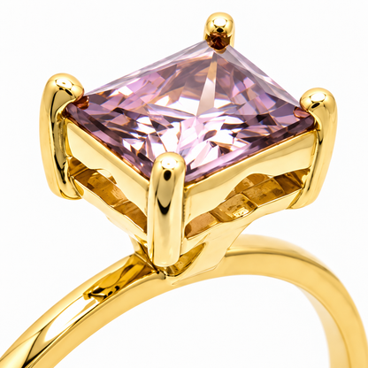 Close-up of emerald-cut grey amethyst prong setting on Golden Geometry 18K Gold Ring by Bed of Stones Jewelry