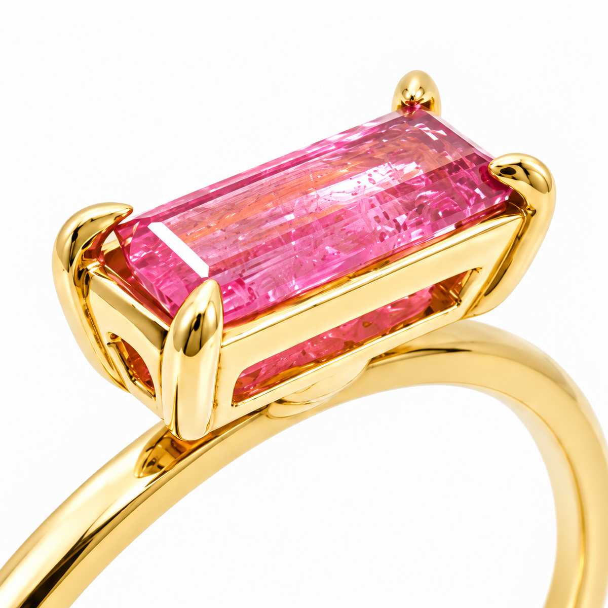 Close-up of baguette-cut pink tourmaline prong setting on Golden Geometry 18K Gold Ring by Bed of Stones Jewelry