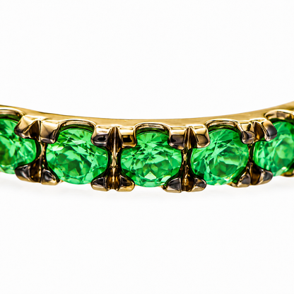 Close-up of tsavorite pavé detail on Green Glam Twist 18K Gold Ear Cuff by Bed of Stones Jewelry