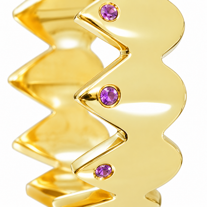 Close-up of round-cut amethyst gypsy setting on Serrated Glow Band Sterling Silver & 18K Gold Plated by Bed of Stones Jewelry