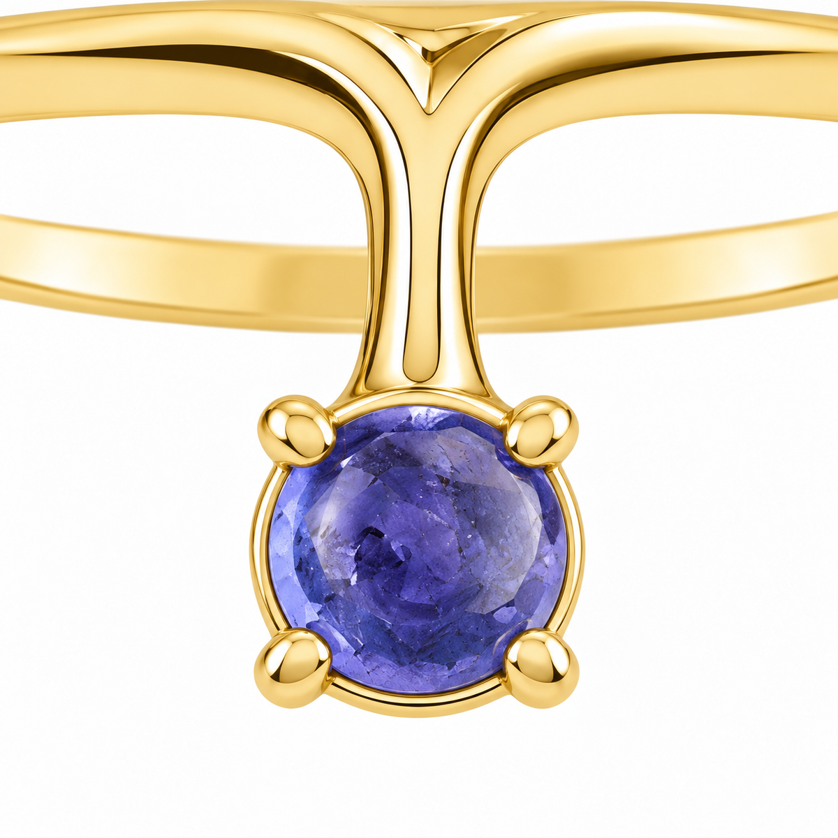 Close-up of cabochon-cut iolite prong setting on Iolite Ray 18K Gold Ring by Bed of Stones Jewelry