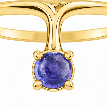 Close-up of cabochon-cut iolite prong setting on Iolite Ray 18K Gold Ring by Bed of Stones Jewelry
