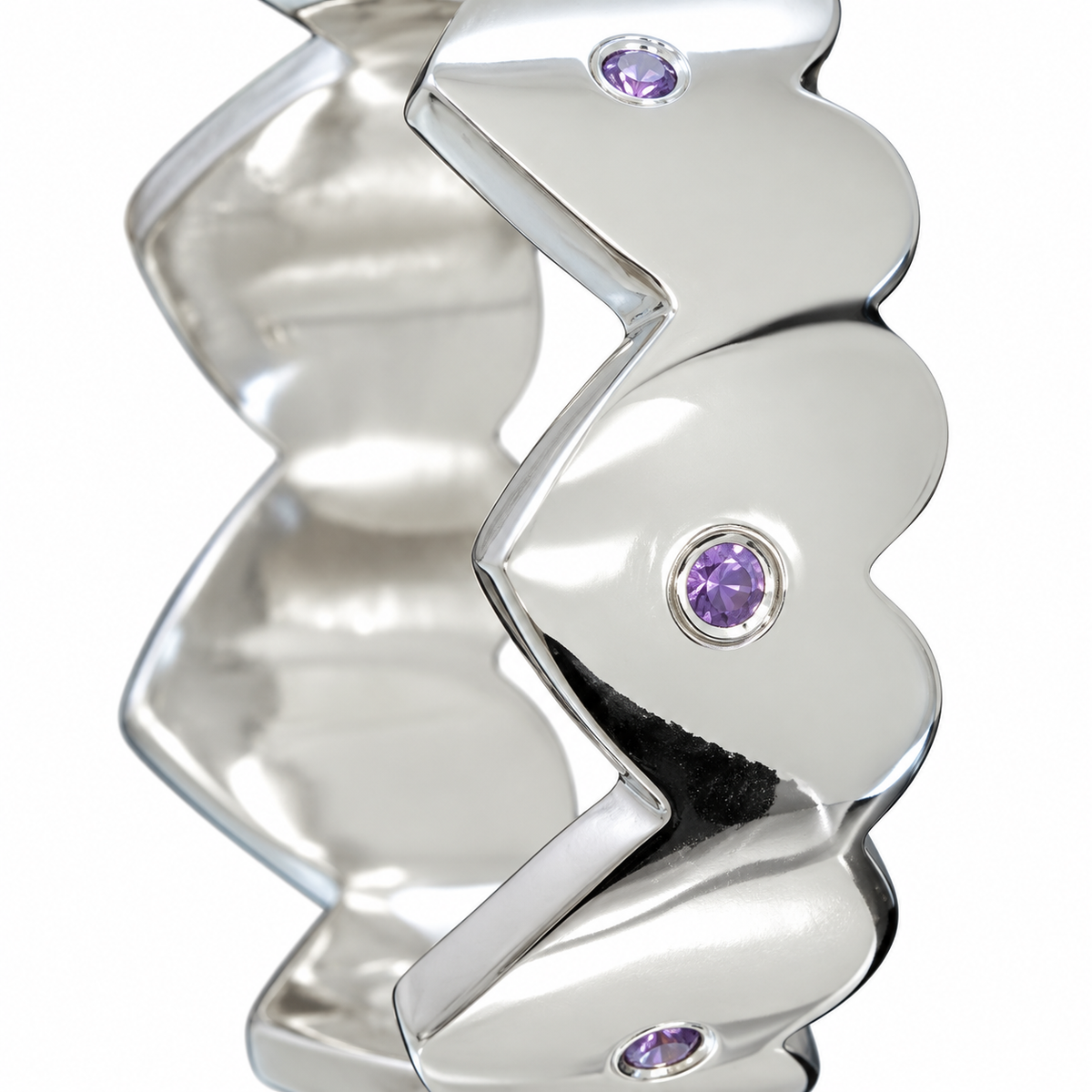 Close-up of round-cut amethyst gypsy setting on Lilac Echo Sterling Silver Ring by Bed of Stones Jewelry