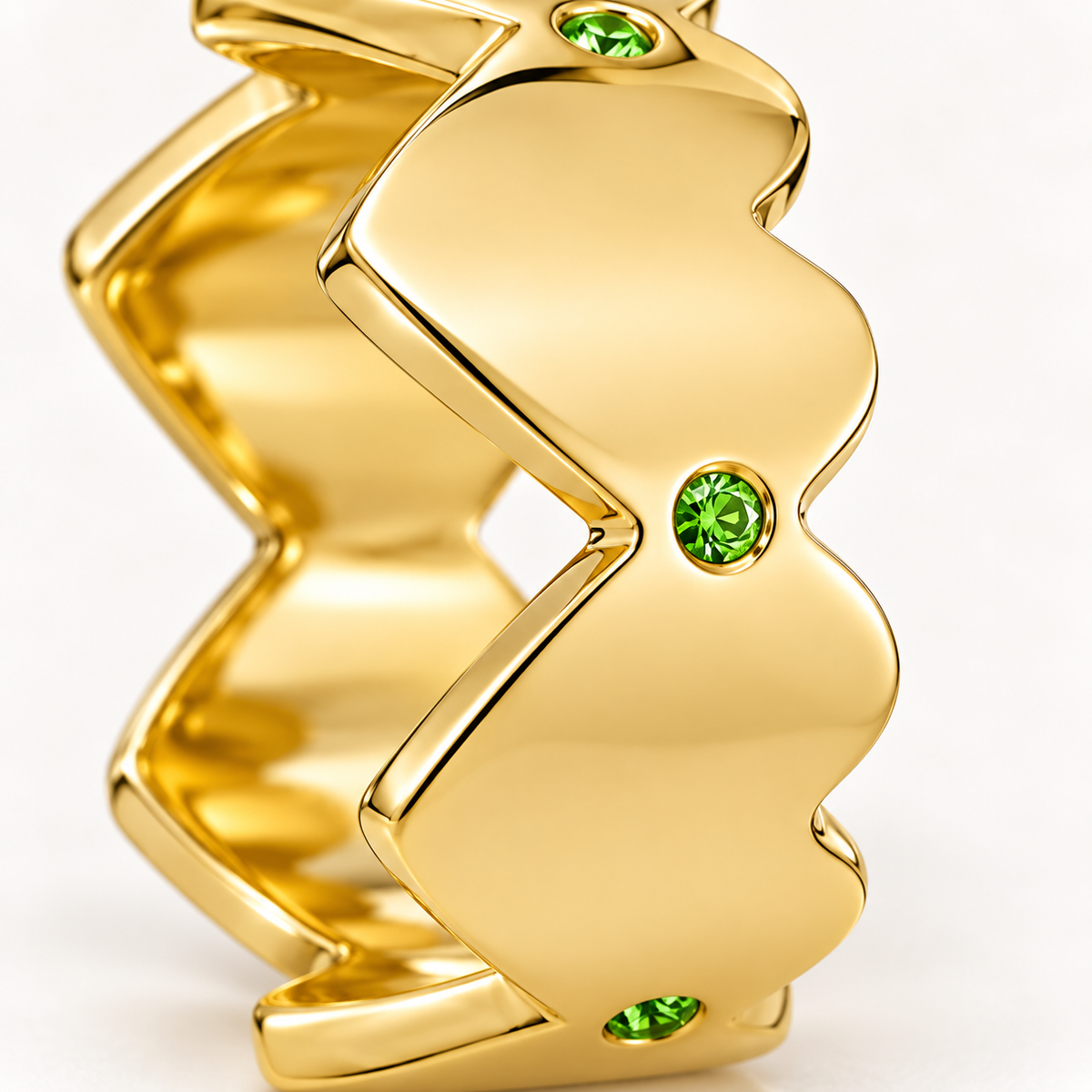 Close-up of round-cut tsavorite gypsy setting on Lime Edge Band Sterling Silver & 18K Gold Plated by Bed of Stones Jewelry