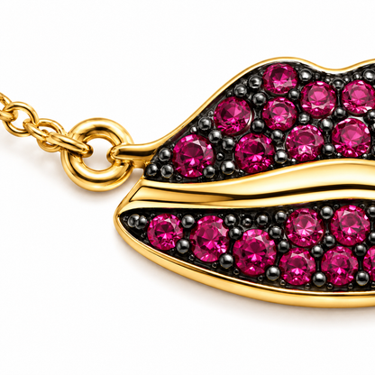 Close-up of ruby pavé lips charm on Lip Luxe 18K Gold Bracelet by Bed of Stones Jewelry