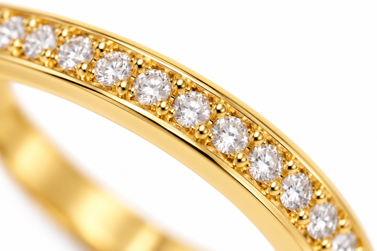 Close-up of round-cut white diamond pavé setting on Lumière Band 18K Gold by Bed of Stones Jewelry