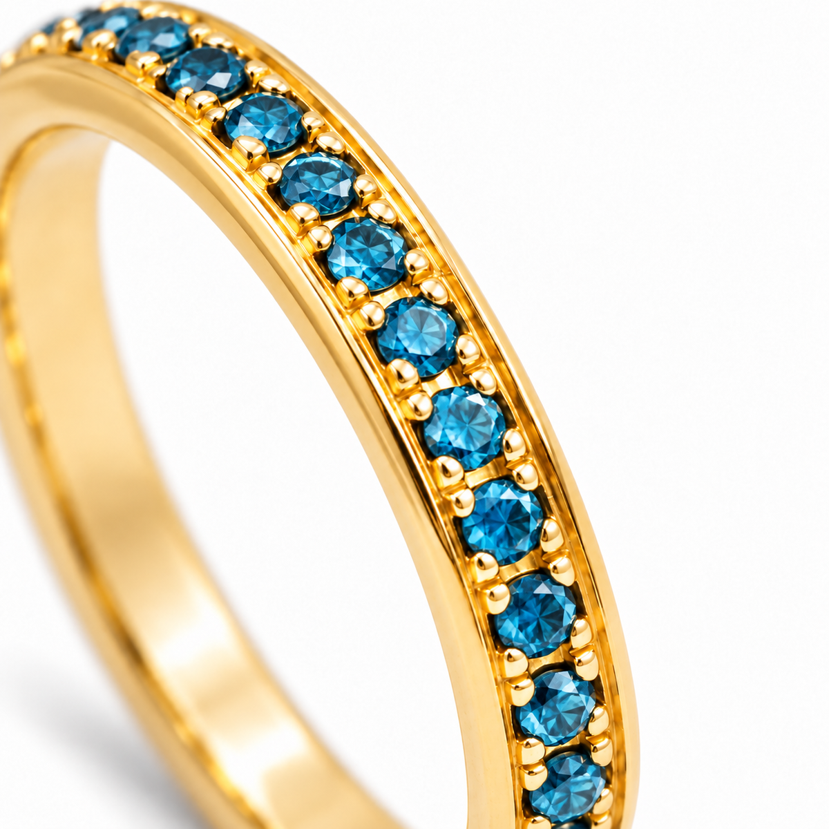 Close-up of round-cut blue diamond pavé setting on Lumière Band Blue 18K Gold by Bed of Stones Jewelry