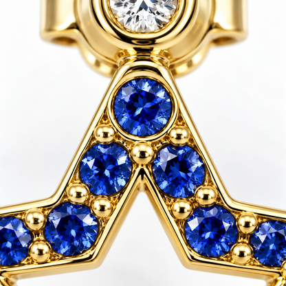 Close-up of blue sapphire pavé and diamond bezel setting on Midnight Spark Earrings by Bed of Stones Jewelry