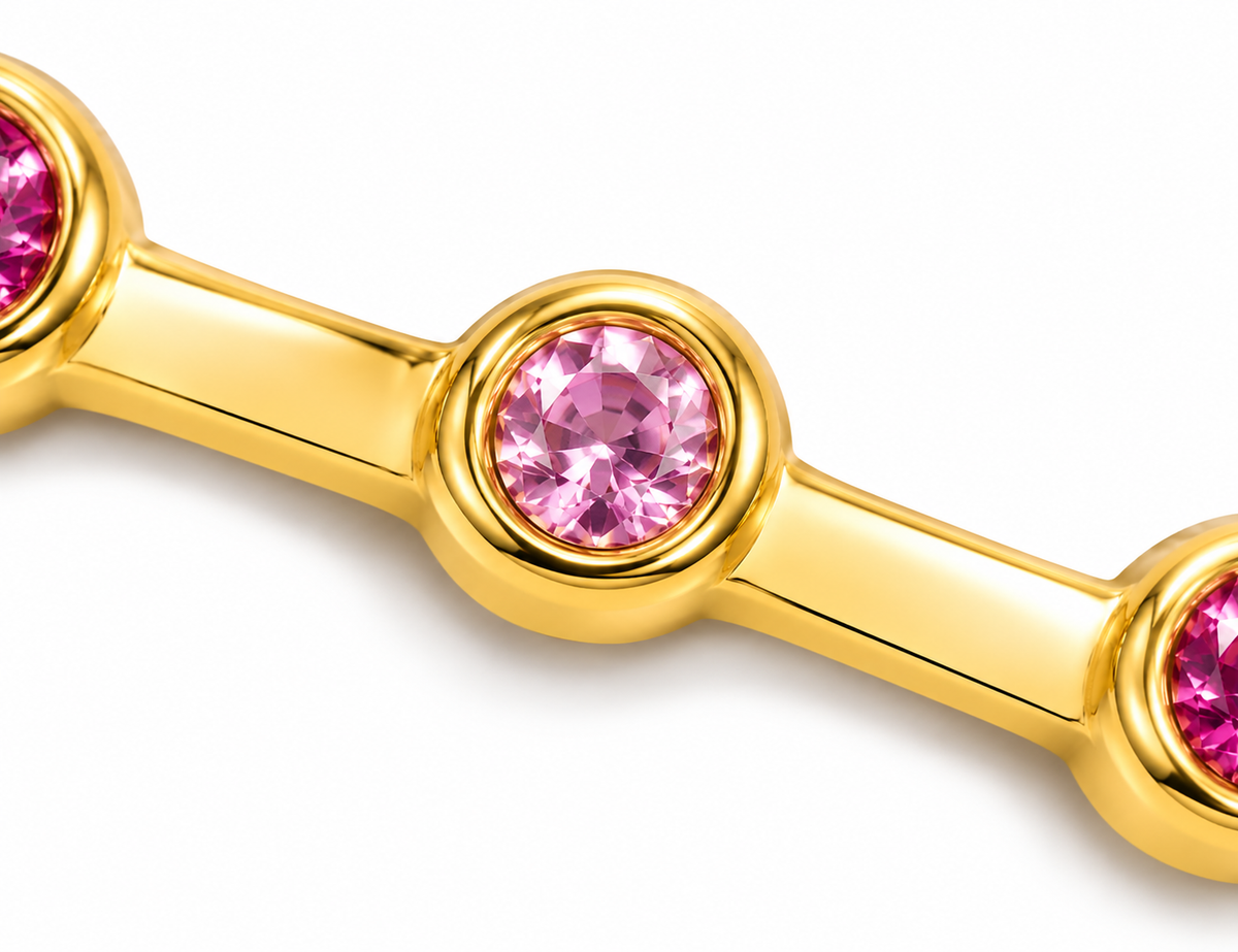 Close-up of round-cut pink sapphire bezel setting on Rosé Glint 18K Gold Ring by Bed of Stones Jewelry