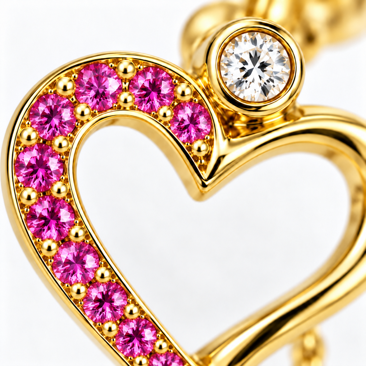 Close-up of pink sapphire bezel and diamond pavé setting on Rosé Heart Earrings by Bed of Stones Jewelry