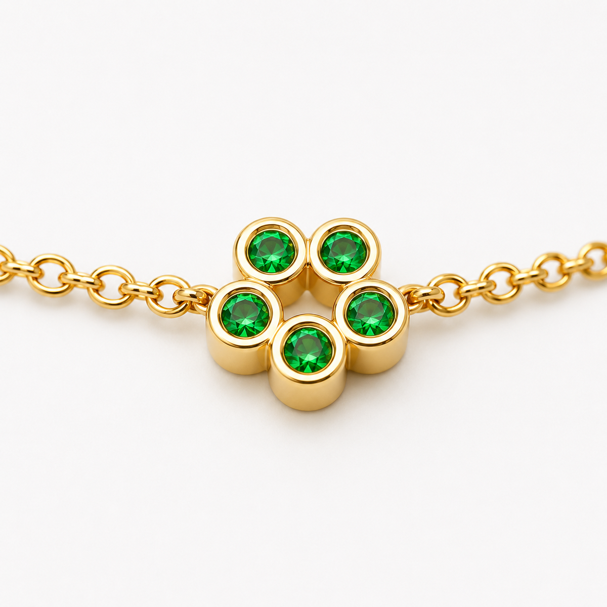 Close-up of tsavorite bezel setting on Rosette 18K Gold Bracelet by Bed of Stones Jewelry