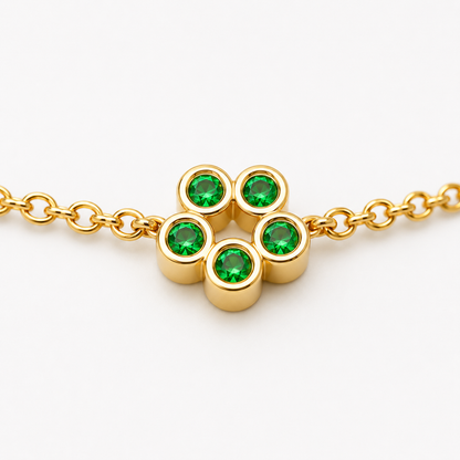 Close-up of tsavorite bezel setting on Rosette 18K Gold Bracelet by Bed of Stones Jewelry