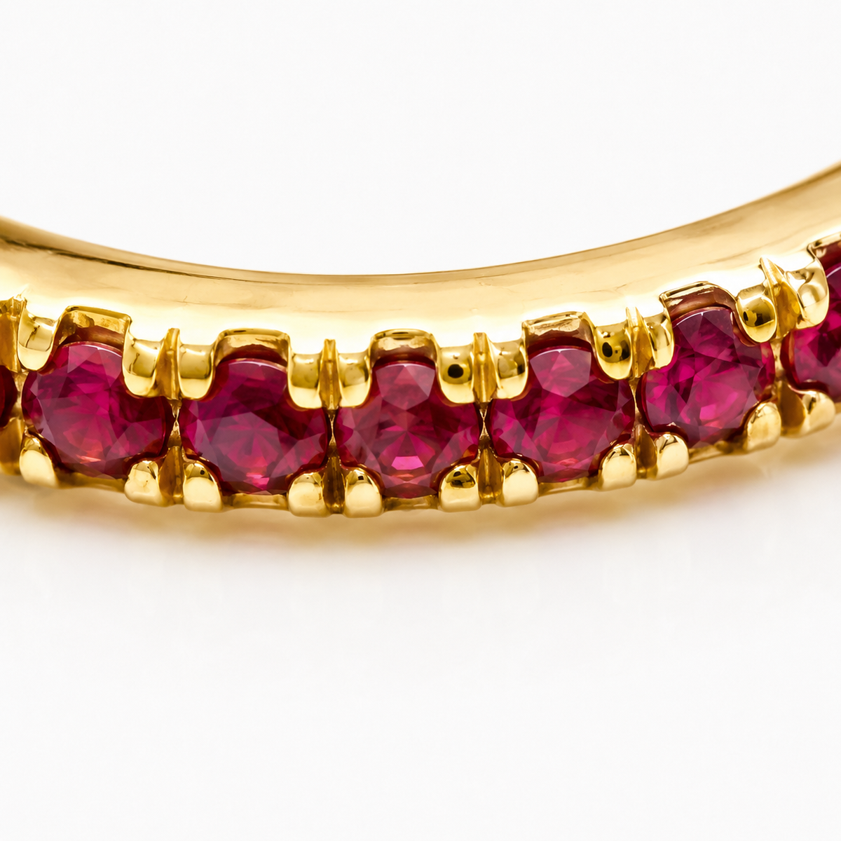 Close-up of ruby pavé detail on Ruby Spiral 18K Gold Ear Cuff by Bed of Stones Jewelry

