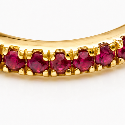 Close-up of ruby pavé detail on Ruby Spiral 18K Gold Ear Cuff by Bed of Stones Jewelry
