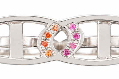 Close-up of round-cut orange and pink sapphire pavé setting on Sapphire Duo Sterling Silver Ring by Bed of Stones Jewelry