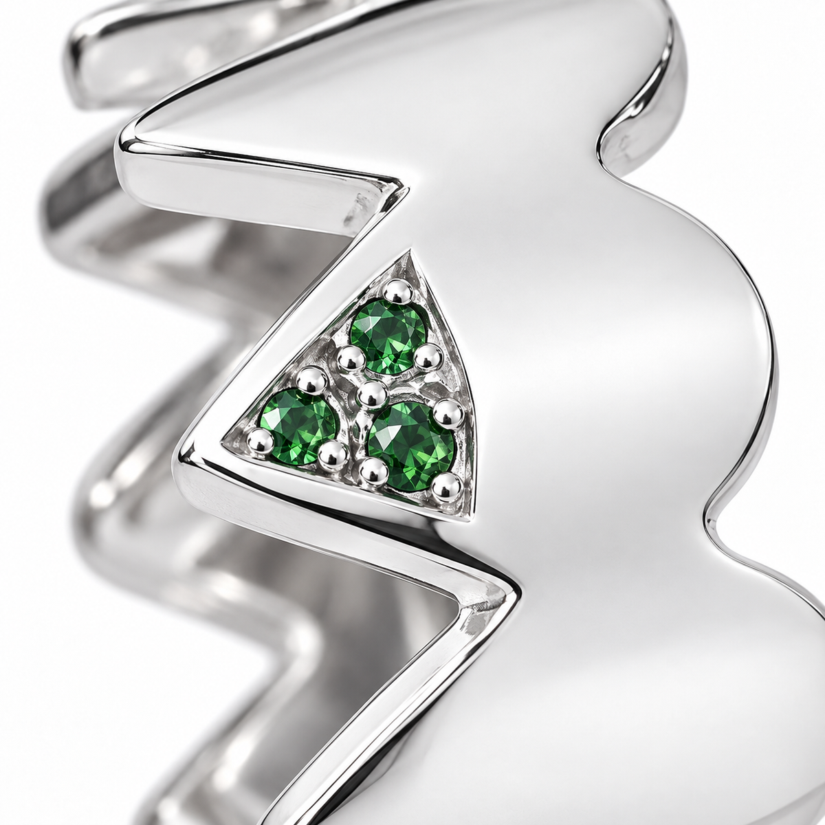 Close-up of round-cut tsavorite pavé setting on Serrated Verdure Band Sterling Silver by Bed of Stones Jewelry