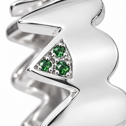 Close-up of round-cut tsavorite pavé setting on Serrated Verdure Band Sterling Silver by Bed of Stones Jewelry