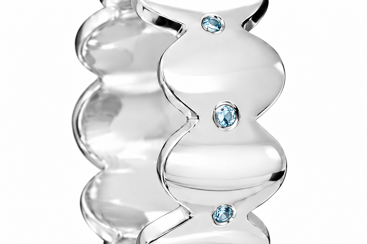 Close-up of round-cut blue topaz gypsy setting on Topaz Edge Band Sterling Silver & Platinum Plated by Bed of Stones Jewelry