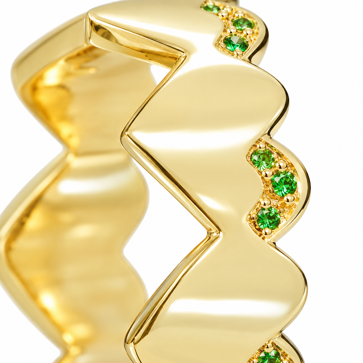Close-up of round-cut tsavorite pavé setting on Tsavorite Curve Band Sterling Silver & 18K Gold Plated by Bed of Stones Jewelry