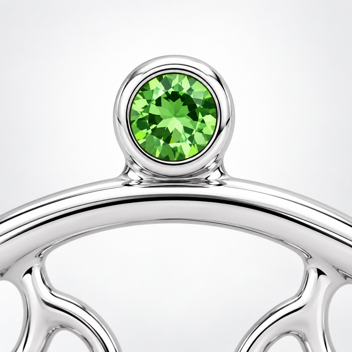 Close-up of tsavorite bezel setting on Tsavorite Droplets Earrings by Bed of Stones Jewelry