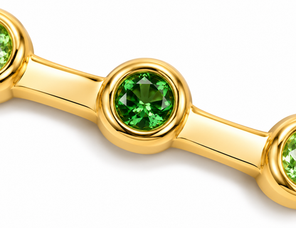 Close-up of round-cut tsavorite bezel setting on Verdant Glint 18K Gold Ring by Bed of Stones Jewelry