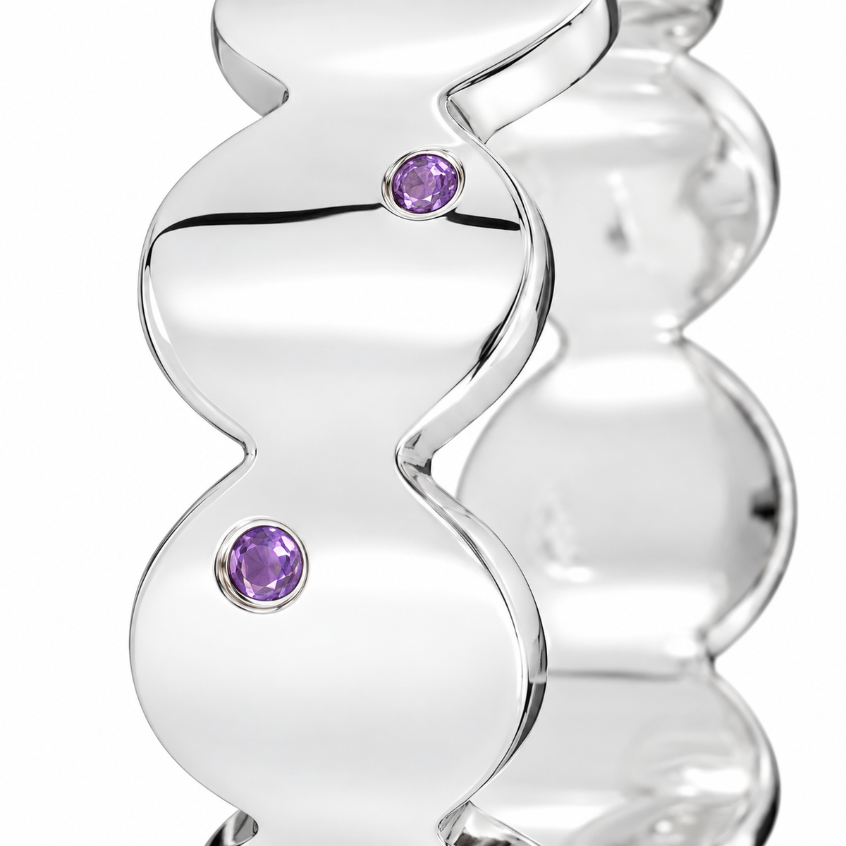 Close-up of round-cut amethyst gypsy setting on Violet Rhythm Band Sterling Silver by Bed of Stones Jewelry