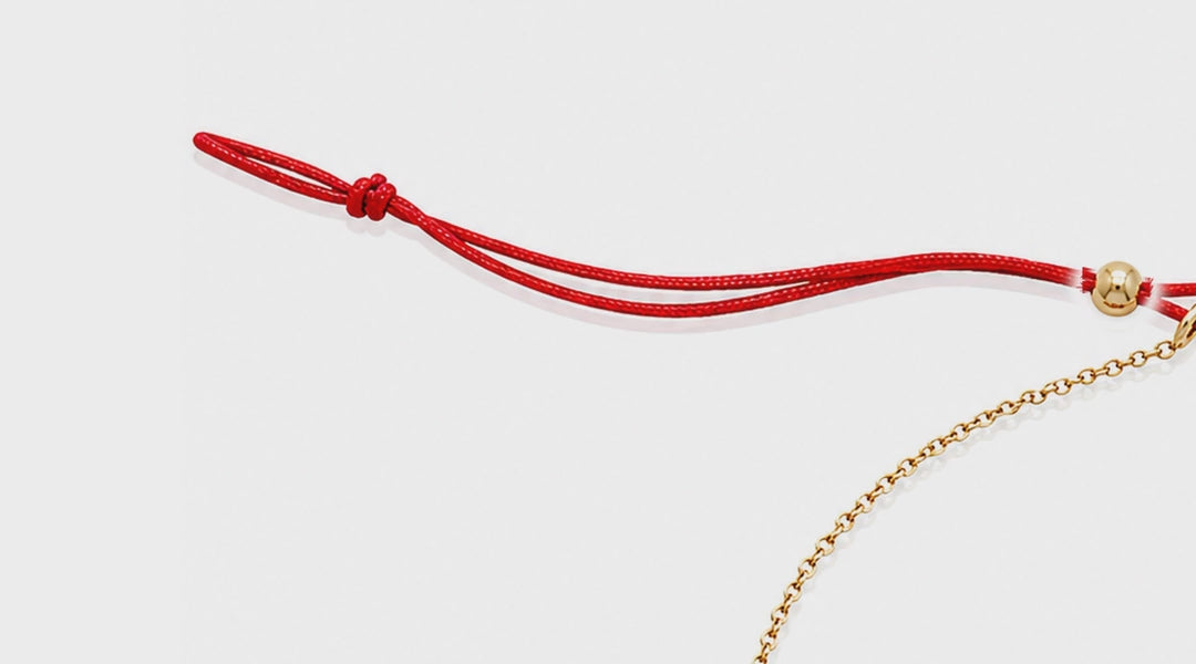 Lip Luxe 18K Gold Bracelet by Bed of Stones Jewelry, close-up video of sliding bead closure in use